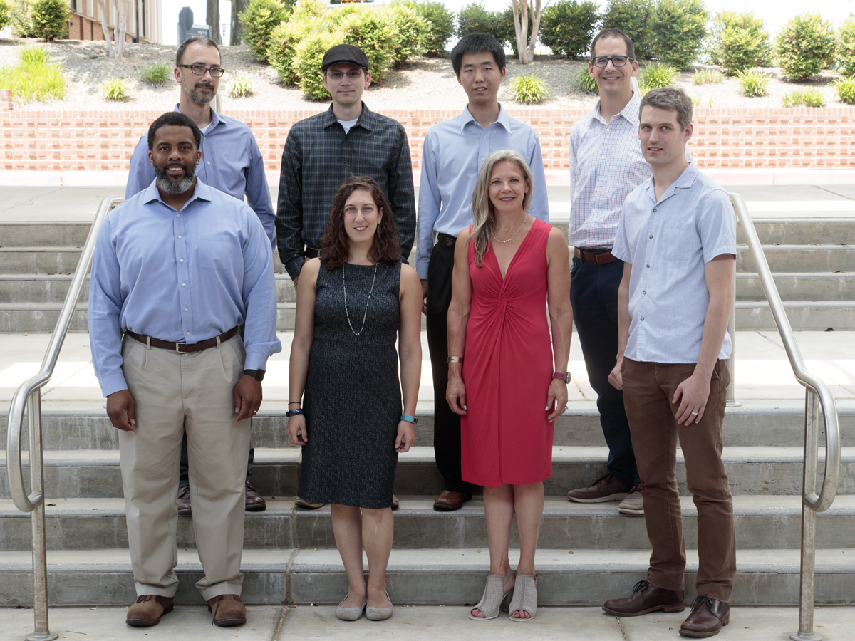 The eight members of the D.Eng. pilot cohort are (back row, left to right) Myron Brown, Seth Myers, Peter Gu and Bart Paulhamus; (front row, left to right) Jeffrey Chavis, Kara Shipley, Jennifer McKneely and Peter Thielen