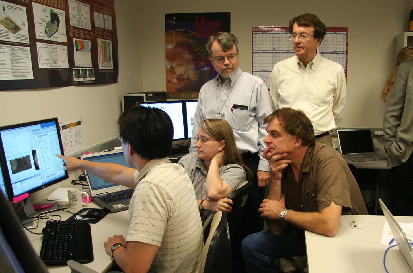 CRISM team members (from left) Teck Choo, Melissa Wirzburger and Kevin Heffernan, CRISM Principal Investigator Scott Murchie, and former APL Space Department Head Tom Krimigis