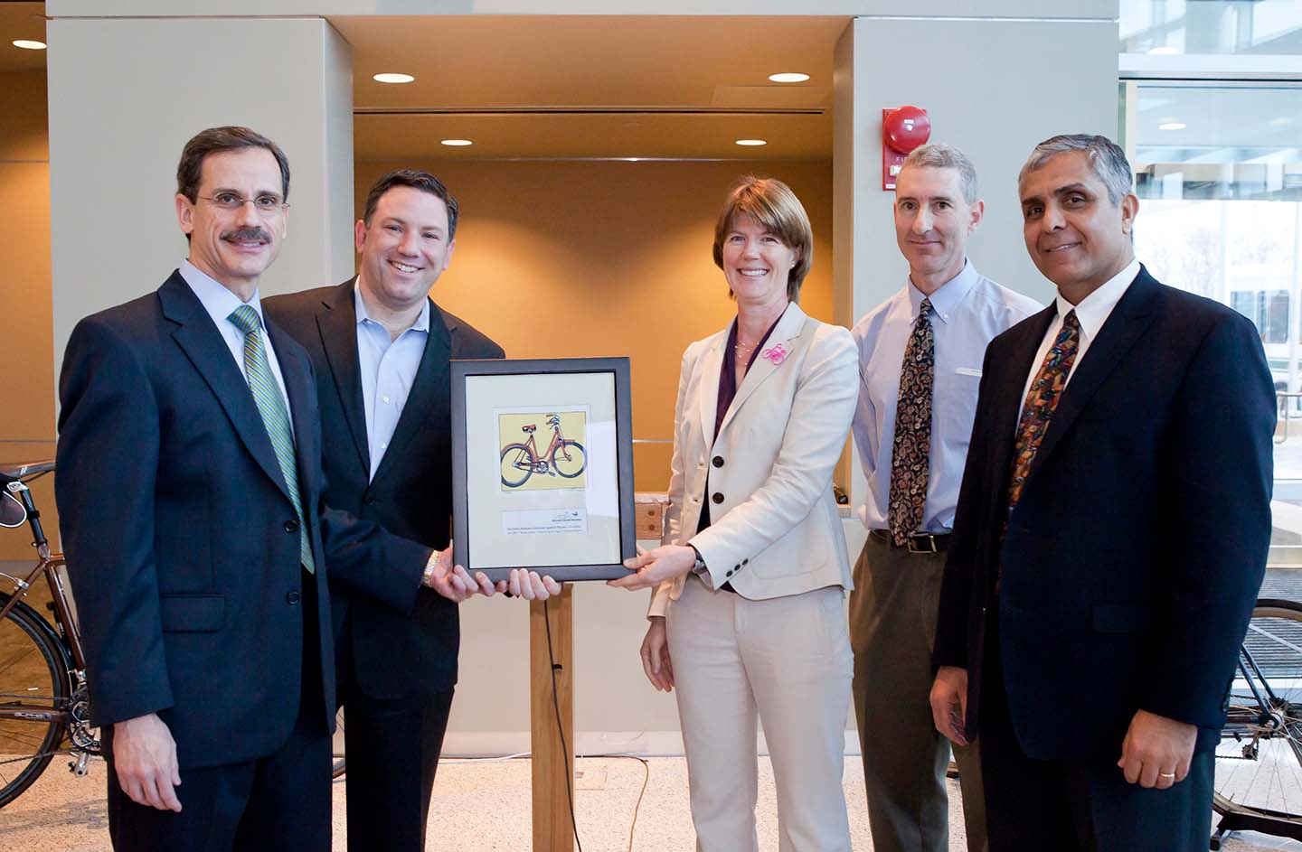 APL leaders pose with Bike Friendly Business Award