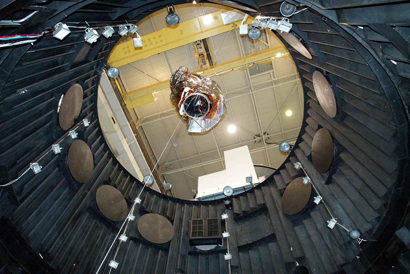 A crane lifts MESSENGER out of the thermal vacuum chamber at NASA's Goddard Space Flight Center