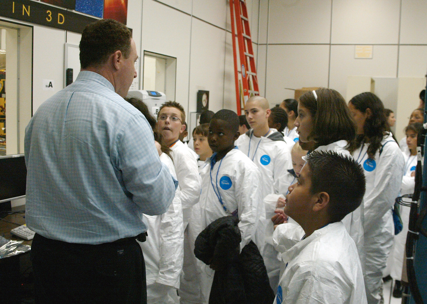 Andy Driesman talks to a group of students during Space Academy: Mission STEREO