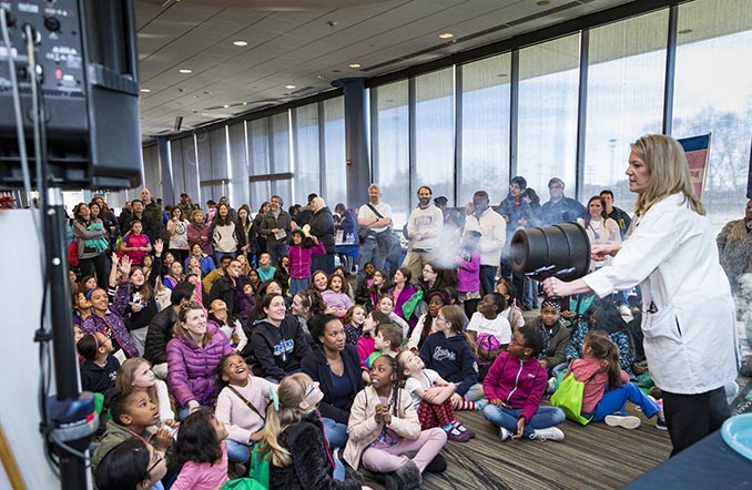 Teacher working with a crowd of kids