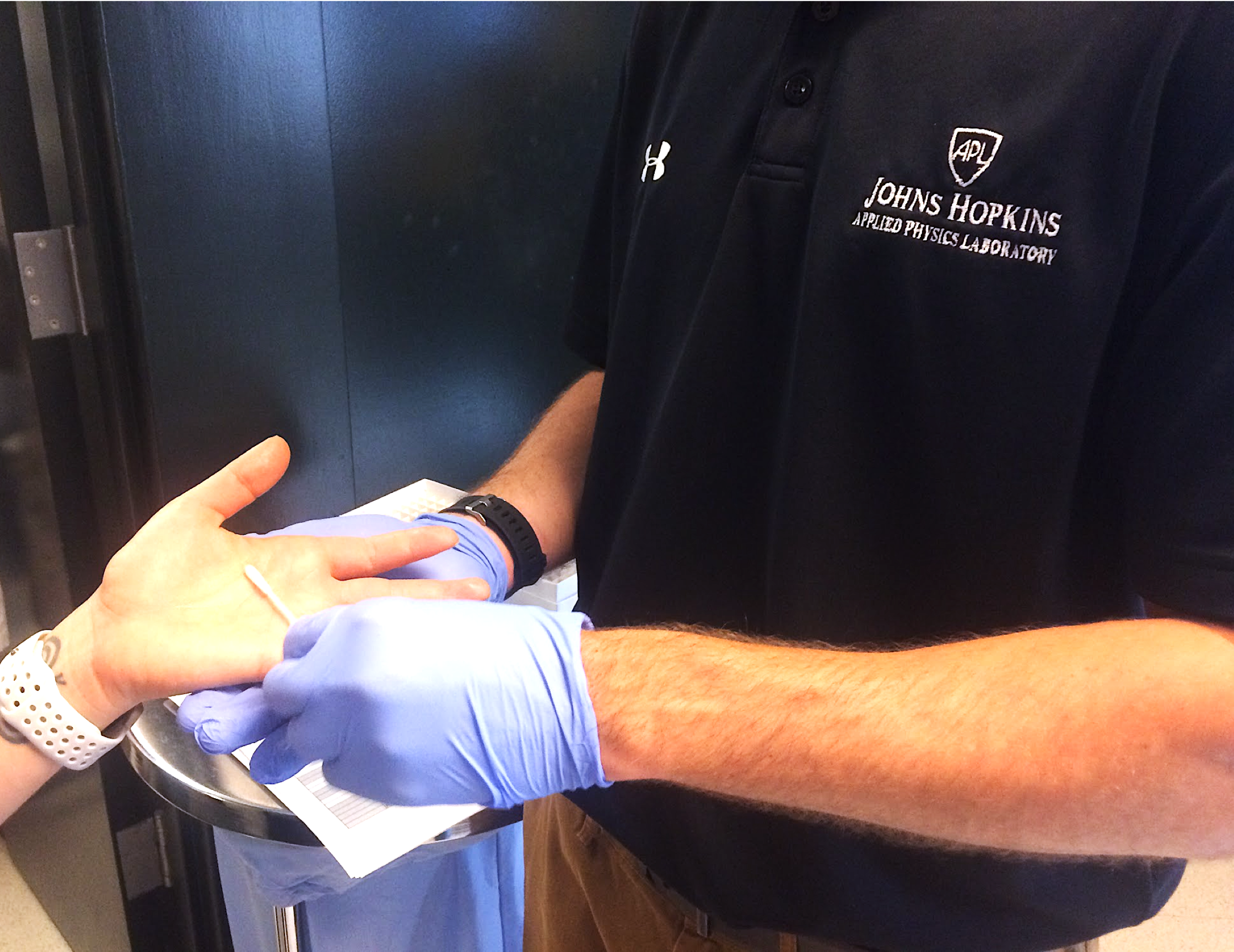 APL researcher swabs a hand