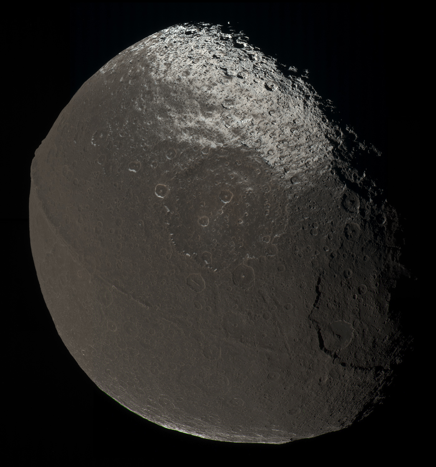 An approximate natural color mosaic of Saturn's moon Iapetus snapped by cameras on NASA's Cassini spacecraft