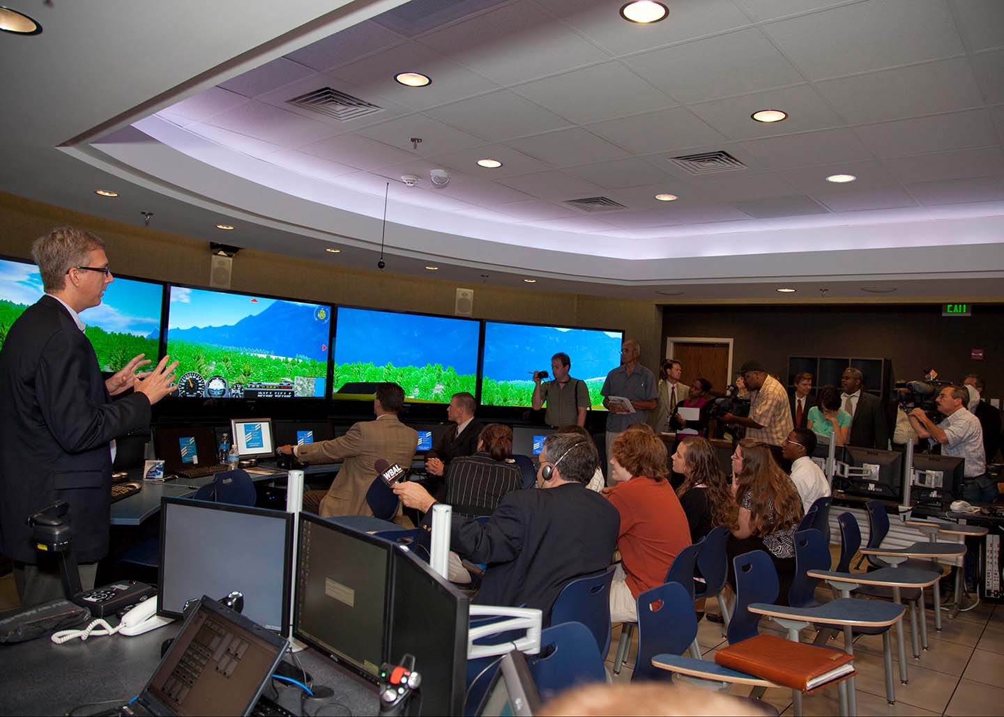 APL software engineers Jim Miller and Kevin Huber, seated at the controls of the Virtual Learning Environment (VLE), and Dave Peloff, of JHU's Center for Technology in Education (standing at left)