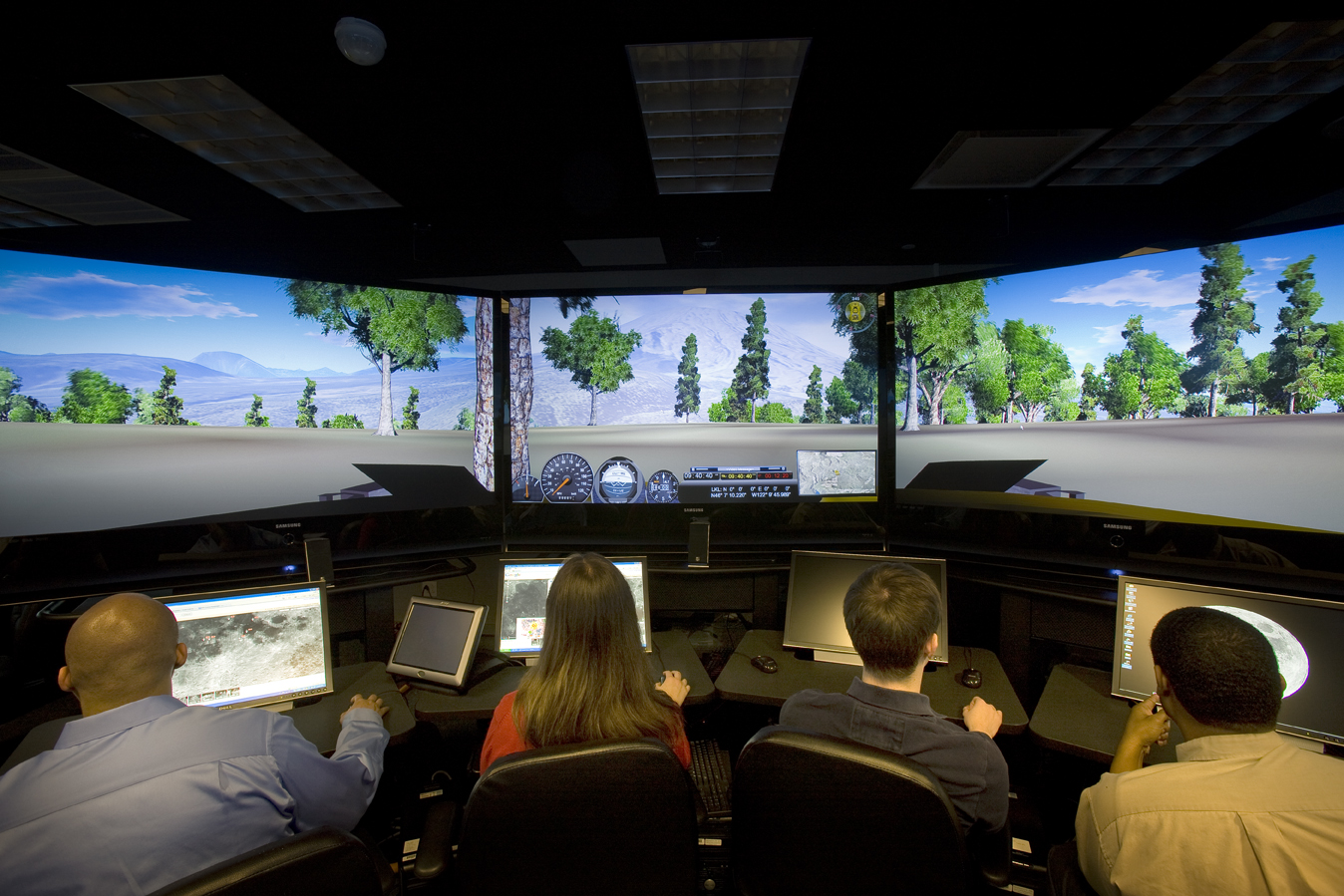 Staff members at APL test drive the virtual learning environment's land-based vehicle toward Mount St. Helens