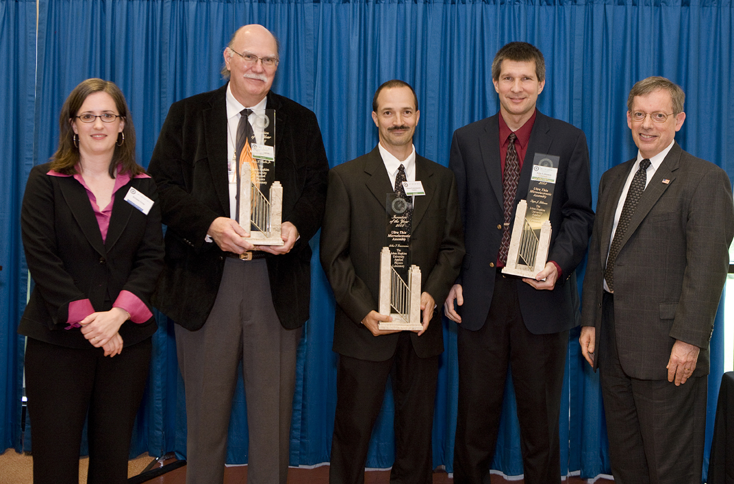 APL Technology Transfer Director Kristin Gray (far left) and APL Director Rich Roca (far right) present APL Invention of the Year awards to (from left) Harry Charles, Shaun Francomacaro and John Lehtonen.