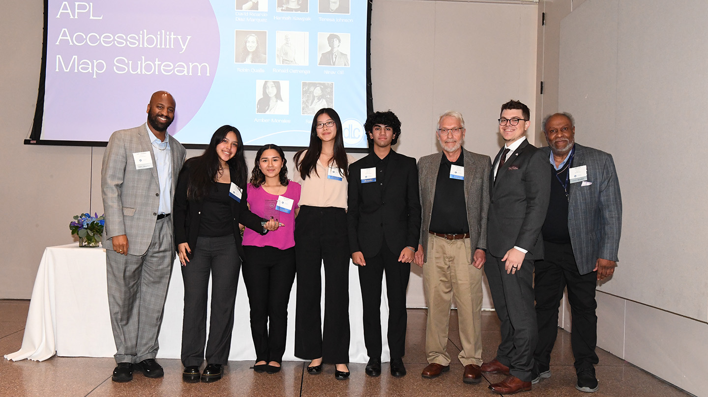 Members of the interactive accessibility map development team receive their award on May 10