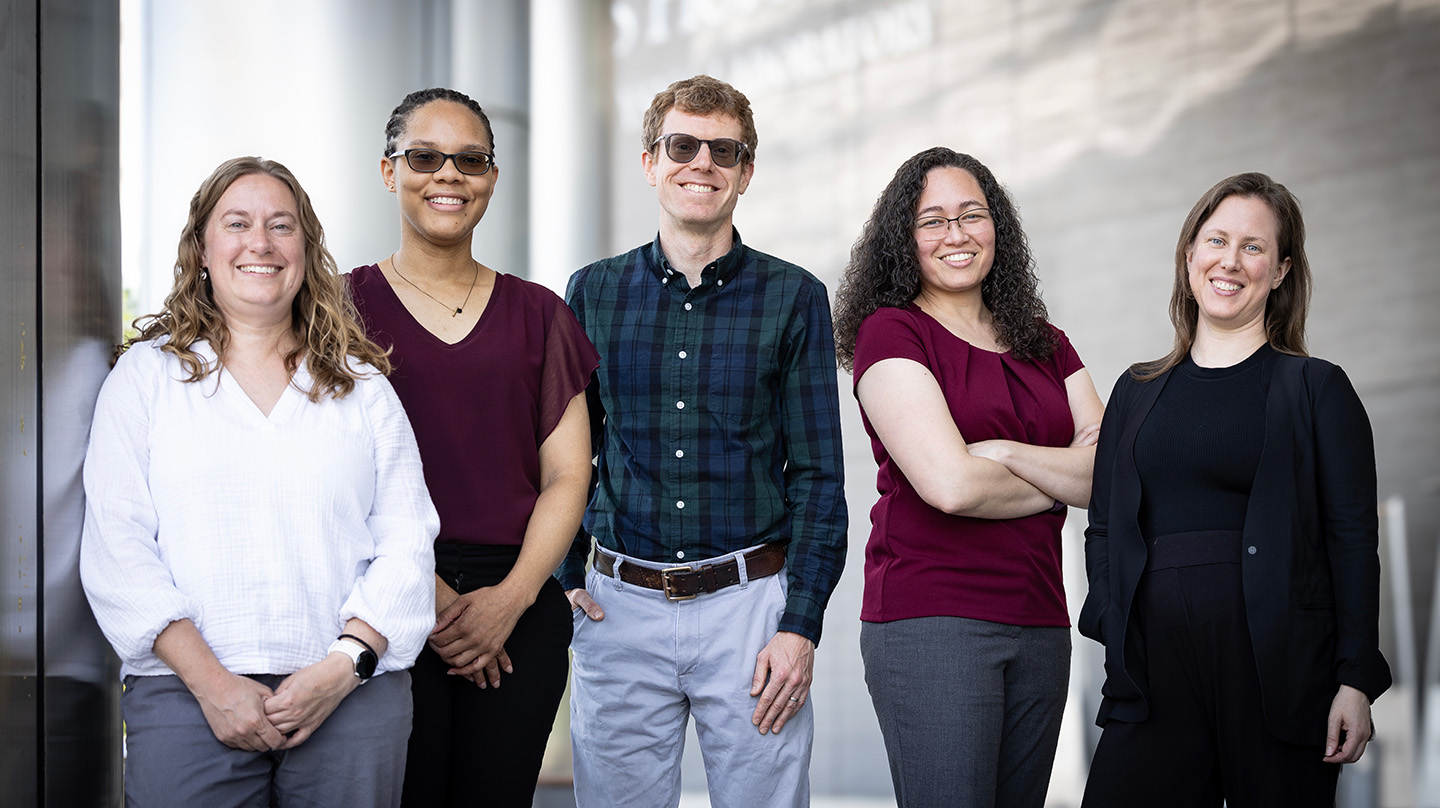  APLers Rebecca Eager, Valerie Washington, Jared Markowitz, Marisel Villafane-Delgado and Krista Rand, who are working with researchers from the Whiting School of Engineering on a 2024 Discovery Award-funded project to improve how humans predict and prepare for climate impacts on critical infrastructure. (Credit: Johns Hopkins APL/Ed Whitman)