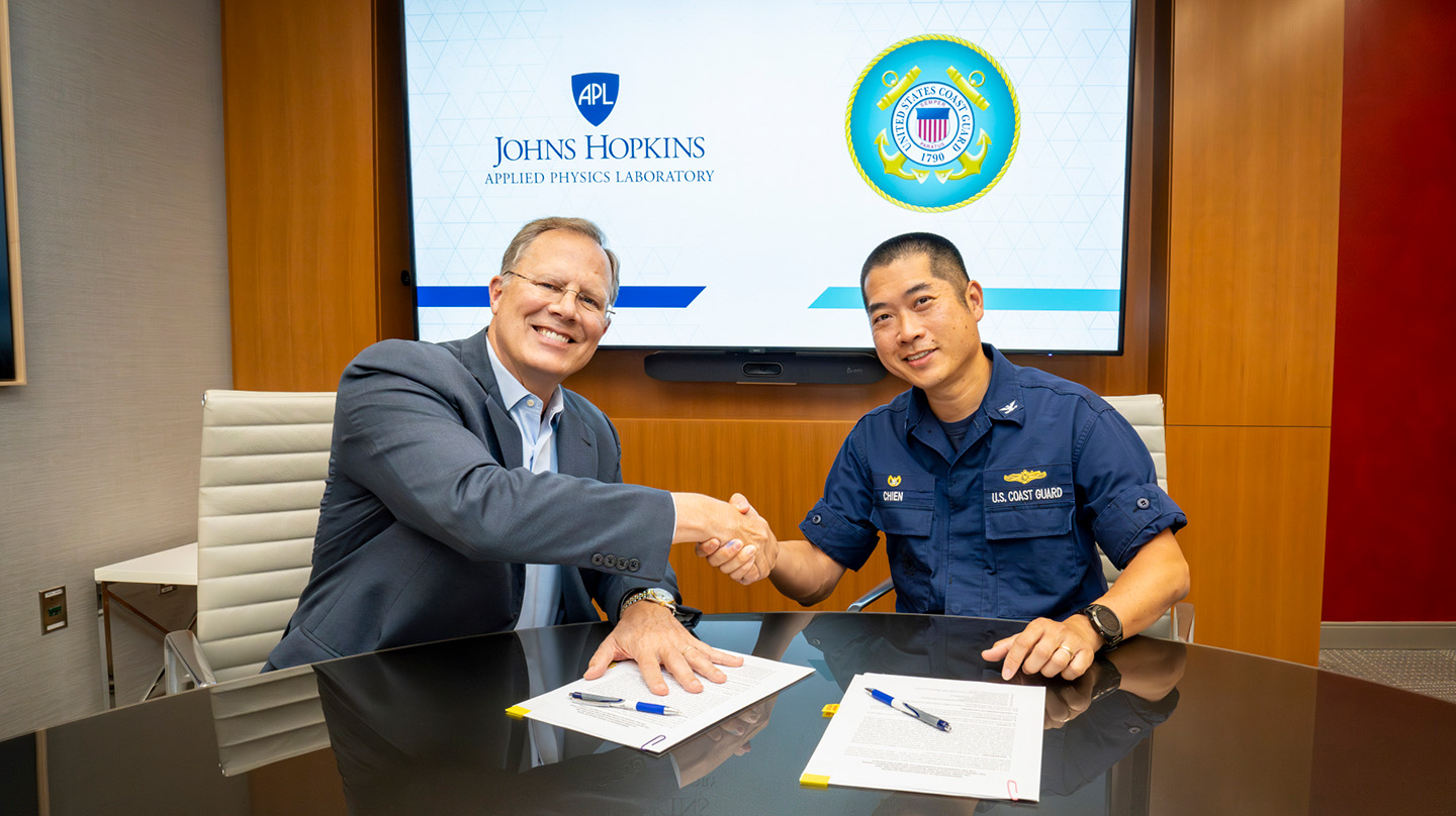 APL Assistant Director Tim Galpin and U.S. Coast Guard Research and Development Center commanding officer Capt. Michael Chien signed a memorandum of understanding at APL on Aug. 5.