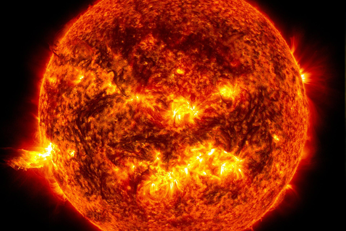 This image from June 20, 2013, at 11:15 p.m. EDT shows the bright light of a solar flare on the left side of the sun and an eruption of solar material shooting through the sun’s atmosphere, called a prominence eruption. Credit: NASA/Goddard/SDO