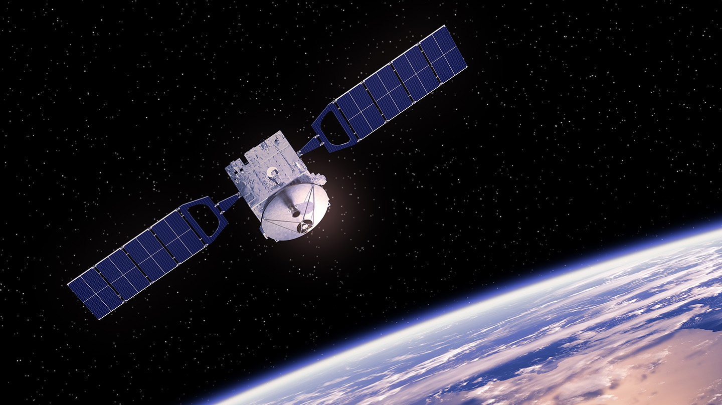 Satellite orbiting Earth (Credit: Bigstock)