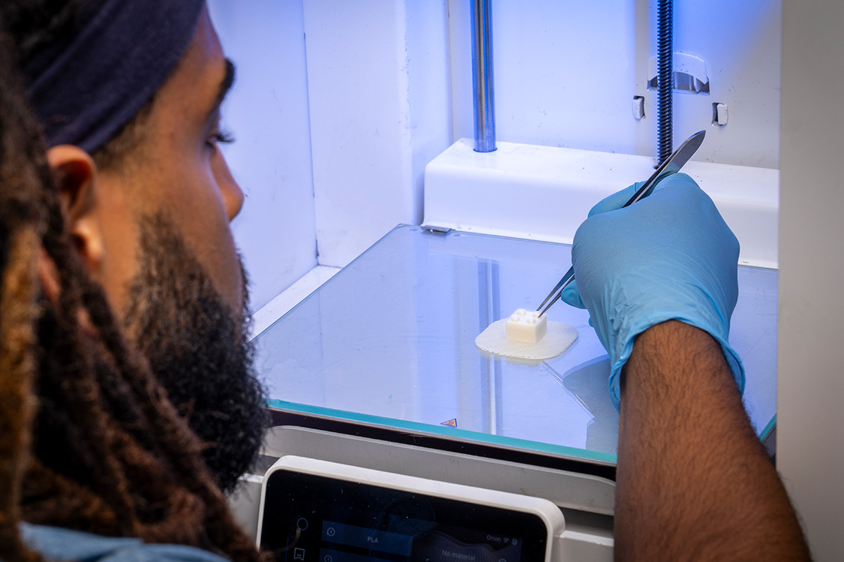 A researcher experiments in APL’s biomanufacturing lab. (Credit: Johns Hopkins APL)