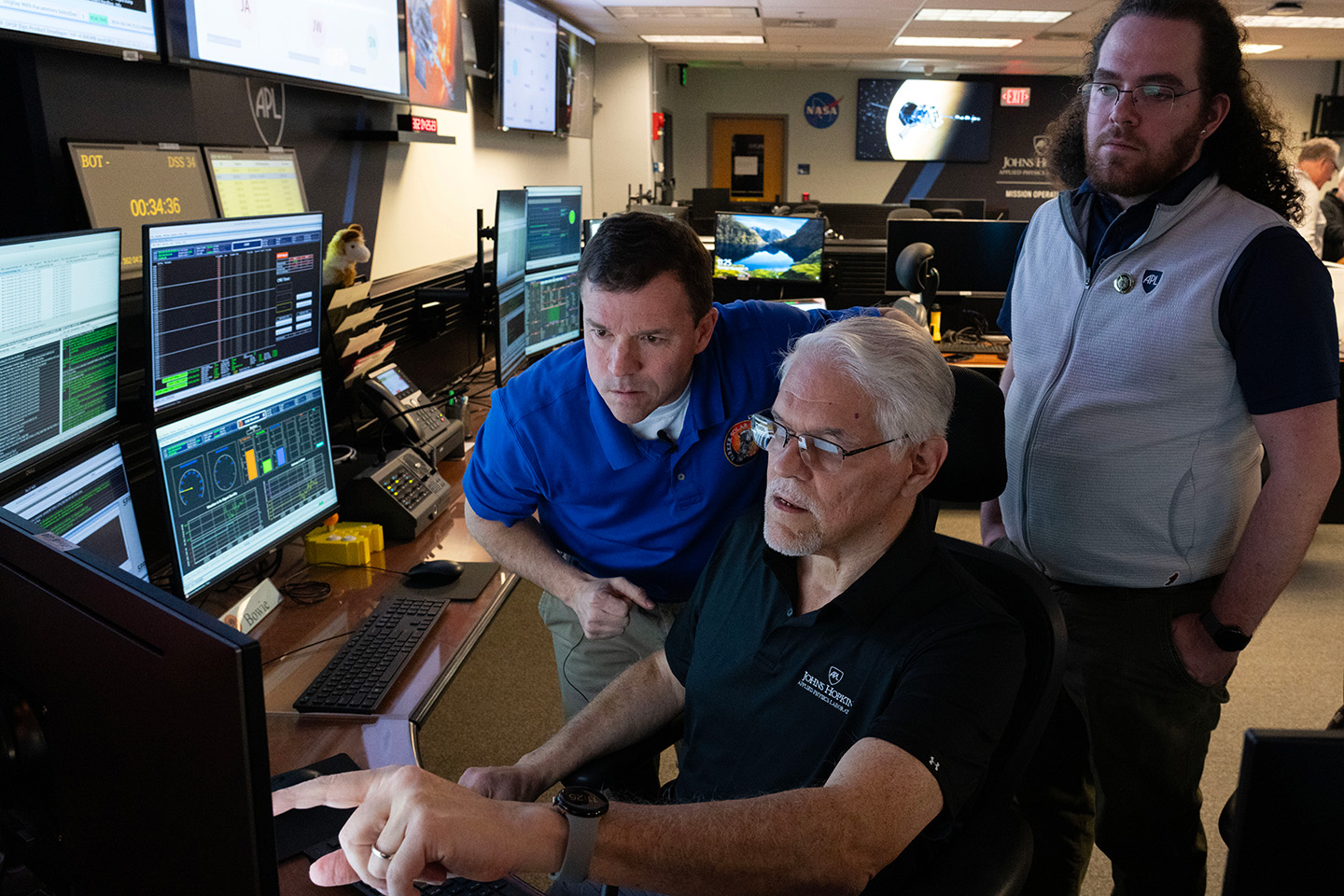 Nick Pinkine, Eliud Bonilla, and Nate Arbor await a signal from Parker Solar Probe indicating its status following its record-breaking flight on Dec. 24, 2024, just 3.8 million miles from the Sun’s surface