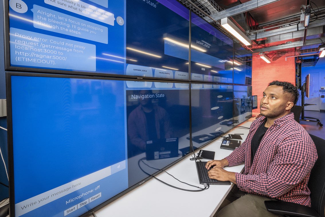 Devin Ramsden, an AI developer at APL, demonstrates a large language model (LLM) grounded by a direct acyclic graph (DAG) to assist warfighters in administering critical care on the battlefield.