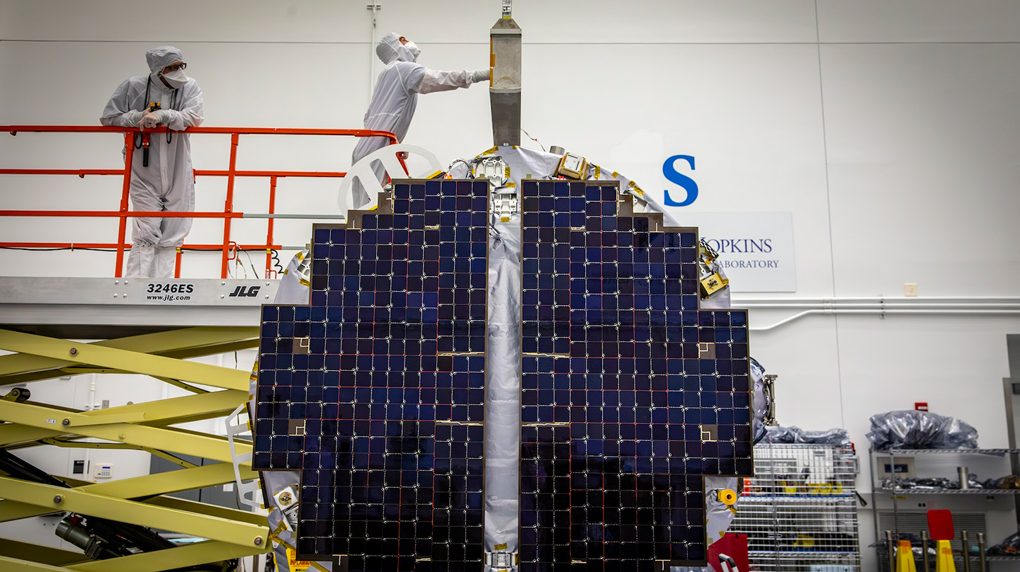 Emory Toomey and Tyler Radomsky prepare to lift NASA’s Interstellar Mapping and Acceleration Probe for testing