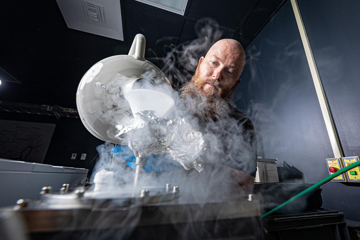 APL staff member conducts research in the Simulated Airless Body Emission Laboratory